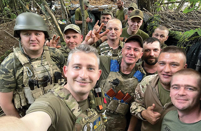 Koļa Serga together with Ukrainian soldiers on the front Personal photo